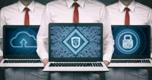 Laptops displaying cybersecurity icons held by business professionals, symbolizing certificate management and SAP Security in modern IT environments.